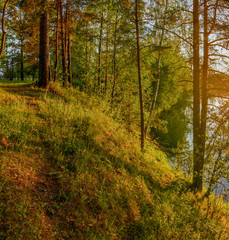 Summer sunset on the Bank of the quarry. The fading light of the sun.