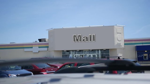 A daytime establishing shot of a generic shopping mall