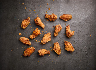 fried chicken on a dark background, top view
