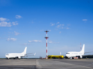 Fototapeta na wymiar Pre-flight and refueling and Loading cargo service of airplane, Airplane's prepare for take-off in gate, terminal international airport. view through window.