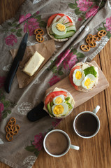 Man holding crisp toast with avocado, cream butter and egg over table. Useful fat and nutritious. Healthy breakfast lunch snack