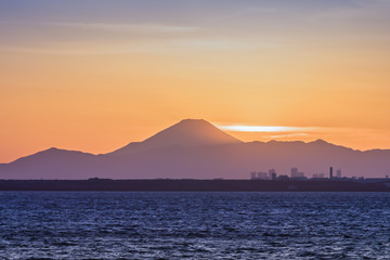 Naklejka na ściany i meble Mountain Fuji and Tokyo bay at sunset time in winter season.Tokyo Bay is a bay located in the southern Kanto region of Japan, and spans the coasts of Tokyo, Kanagawa Prefecture, and Chiba Prefecture.