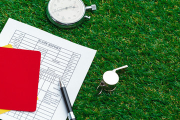 two penalty cards and a whistle for the referee