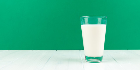 panorama glass milk with green background