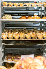 The process of baking rolls. Roast with buns and pastries. Bakery