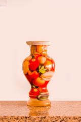 A large jug of canned vegetables. Turkish cuisine. White background.
