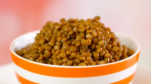 Lentil beans, healthy source of dietary fibre and protein, slow turning dolly macro.