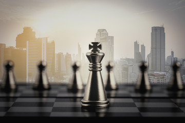Chess game on the board for competition with the modern building of Asia Business financial...