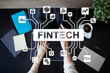 Fintech. Financial technology text on virtual screen. Business, internet and technology concept.