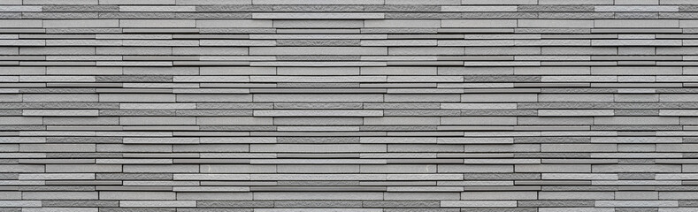 Fototapeta premium Panorama of Modern grey stone wall pattern and background