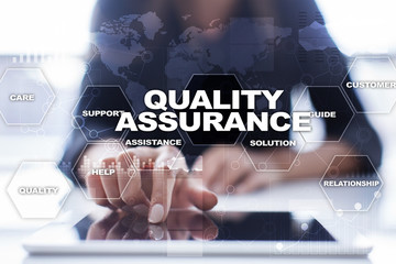 Quality assurance concept on the virtual screen. Business concept.