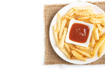 French fries with ketchup on wooden background.