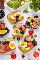 toasts with canned tuna on a paper