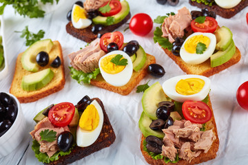 toasts with canned tuna on a table