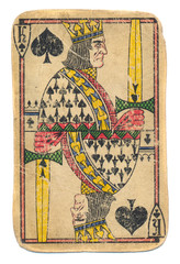 Antigue used playing card king of spades isolated