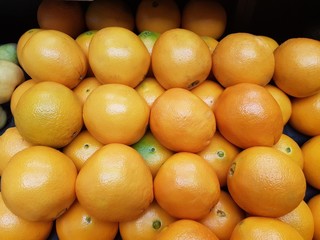 Fresh oranges on display background