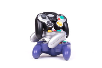 Video game controllers on white background