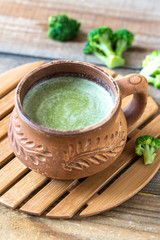 Cup of broccoli coffee with broccoli florets