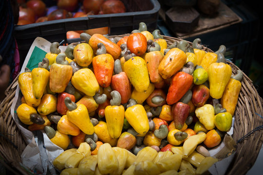 basket of cashew fruit, sold at a market in the south of india