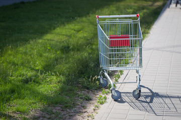 An empty cart for products near the supermarket