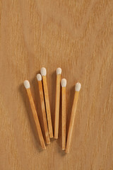 some matches on a wooden table