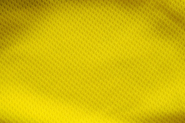 Yellow color football jersey clothing fabric texture sports wear background, close up