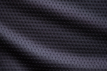 Obraz na płótnie Canvas Black fabric sport clothing football jersey with air mesh texture background