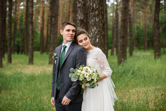 Walking wedding couple in the forest
