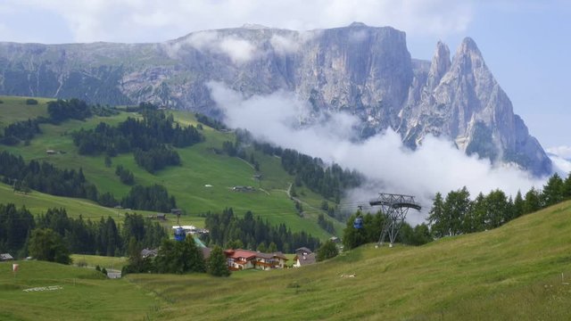 Video of the Schlern Massiccio dello Sciliar mountains on the Italian Alps Dolomites with cable cars passing by