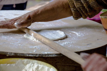 Women's hands make dough for Azerbaijani dish Gutab