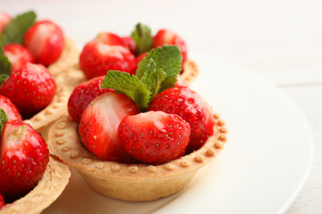 Ripe strawberries in tartlets
