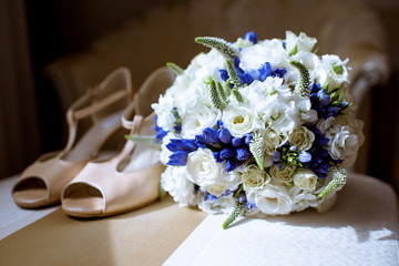 Beautiful wedding colorful bouquet and shoes for bride