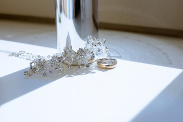 Beautiful wedding rings and perfume bottle for bride and groom