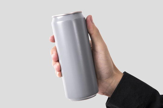 Hand Holding Aluminum can for mockup template advertising and branding background.
