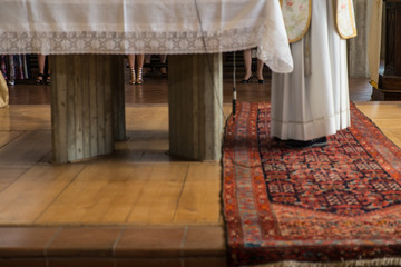 Various sexy naked woman legs inside a church during an official christianity ceremony