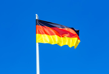 Flag of Germany flying in the wind against the sky