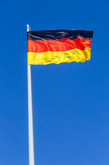 Flag of Germany flying in the wind against the sky