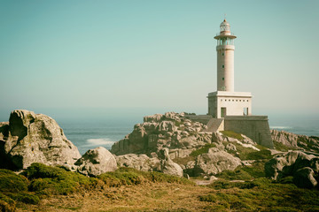 Lighthouse at sunny summer day