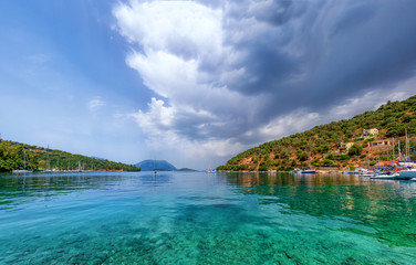 View on the harbour and island with mountains in Vathi village. Meganisi island Ionian sea