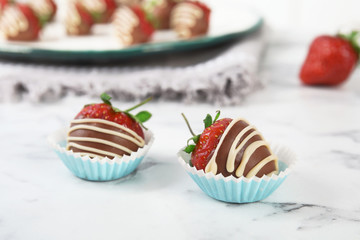 Tasty chocolate dipped strawberries on table, closeup