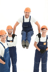construction worker sitting on the shoulders of colleagues