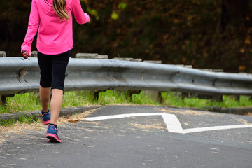 Sport girl leg running in the park