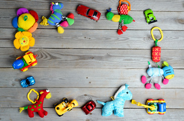 Baby toys frame. Colorful kids toys on white background. Copy space for text. Top view. Flat lay.