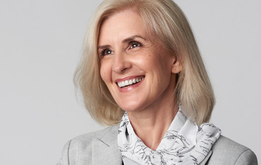Portrait of smiling business woman looking away