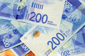 Israeli money stack of the new Israeli money bills (banknotes) of 200 shekel. New Israeli Shekel series C.