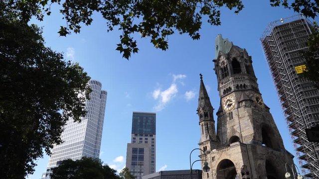 Berlin city center architecture, office high raise building and Kaiser Wilhelm Memorial Church