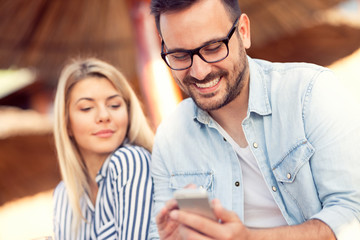 Happy man looking in his screen phone