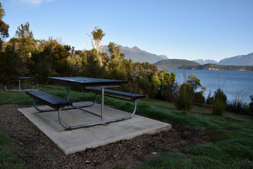 Obraz premium Сamping pitch on summer lake calm beach