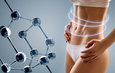 Woman with perfect body near big molecule chain.