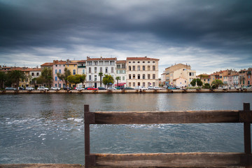 Canal in Venice and black rain clouds